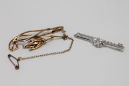 Two 18ct gold diamond set brooches, 7.