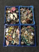 Four crates containing a very large quantity of costume jewellery to include bead necklaces,