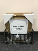 A crate of six 30 cm x 40 cm gilt photograph frames