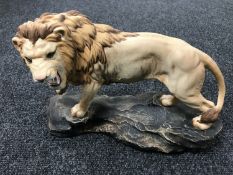 A Beswick figure - a lion on a rock, model 2554A,