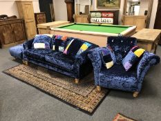 A contemporary three piece lounge suite - comprising of three seater settee,