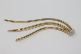 An 18ct gold diamond set hair ornament,