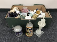 A cased sewing machine together with two boxes containing food steamer, cameras,