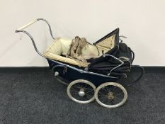 A mid-20th century doll's pram