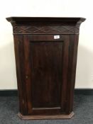 A late 19th century mahogany hanging corner cupboard