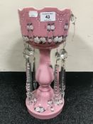 A Victorian hand painted pink glass lustre with drops