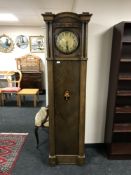 An inlaid oak regulator clock with pendulum and weights