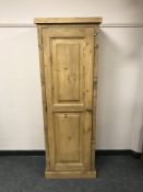 A reclaimed pine single door cupboard