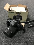 A Fujifilm Finepix HS 30 EXR camera, with strap, boxed.