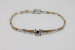 An 18ct white and yellow gold diamond and sapphire set bracelet,