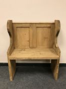 A reclaimed pine small pew