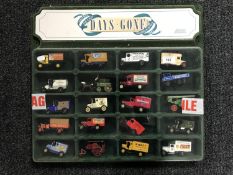 A Days Gone by plastic fronted display case containing twenty die cast delivery vans