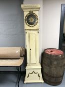 A painted continental longcased clock with pendulum and weights