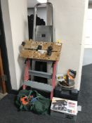 A set of folding aluminium steps together with a workmate hand and power tools