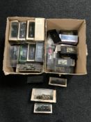 Two boxes of die cast military vehicles,