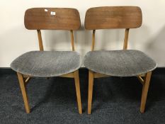 A set of four mid-20th century teak Beautility dining chairs