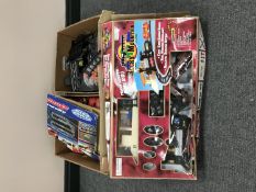 Two boxes of Scalextric track and accessories together with a Rocky Mountain battery operated train