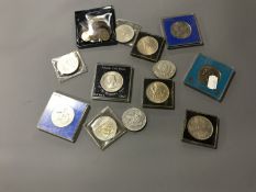 A quantity of assorted crowns, Guernsey £5 coin,