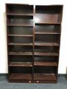 Two sets of narrow mahogany open bookshelves