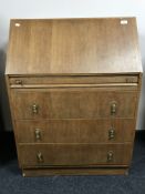 A mid-20th century oak bureau