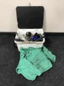 A fishing box containing a wet weather suit, two Scarborough reels, fixed spool reels,