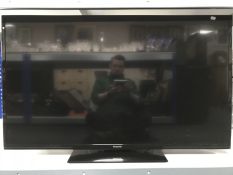 A Panasonic 50 inch lcd tv with lead and remote