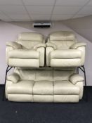 A cream leather three piece suite