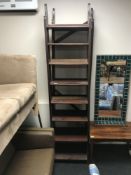 Two sets of narrow pine bookshelves