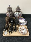 A tray of seven carved wooden elephants, pair of contemporary chinese vases,