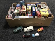 A box of die cast vehicles including classic sports cars, motorbikes,