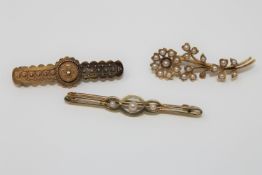 Three 15ct gold brooches, two set with pearls, 8.