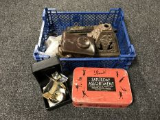 A vintage tin containing part sword scabbard, old camera,