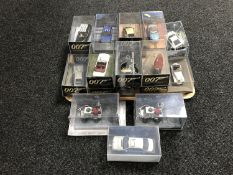 A tray of twenty James Bond die cast vehicles in plastic display cases