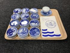 A tray of approximately 48 Royal Copenhagen plaquettes together with accompanying book and Bing &