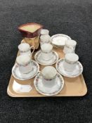 A tray of eight Paragon Belinda china cups and saucers together with a Royal Doulton character jug