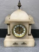 A French opaque marble mantle clock with brass and enamel dial