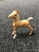 A Beswick figure - model 763 foal (small), stretched, upright, third version, palomino,