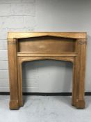 An early twentieth century carved oak fire surround