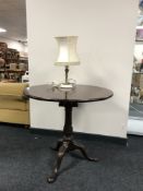 A Victorian mahogany circular pedestal occasional table and gilt metal figural table lamp on marble