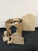 A box of un-finished desk stands and stationary templates