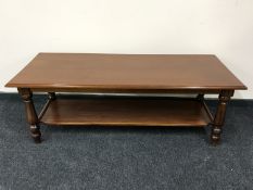A two-tier coffee table in a mahogany finish