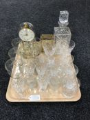 A tray of lead crystal decanter, assorted glass ware, carriage clock,