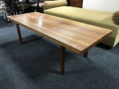 A teak refectory coffee table