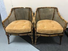 A pair of contemporary bergere backed tub chairs
