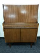 A mid-20th century teak writing bureau