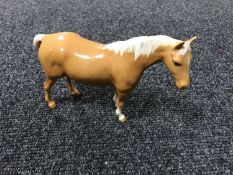 A Beswick figure - Model 1991 Mare (facing right, head up), palomino,
