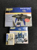 A Powercraft router table together with a 1200W router and box of bits