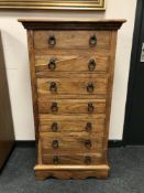 A contemporary John Lewis hardwood seven drawer chest