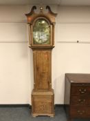 A nineteenth century oak longcased clock with brass dial signed John Ramsbottom with pendulum and