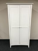 A painted pine double door wardrobe together with a painted pine five drawer chest